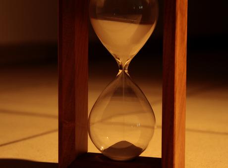 Sand pours in hourglass closeup © AnyVidStudio Sand pours in hourglass closeup © AnyVidStudio
